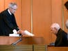 Judge Timothy Feeley, left, addresses former the Rev. Richard J. McCormick, who was convicted of rape in 2014 and sentenced to up to 10 years. McCormick since has pleaded guilty to assaulting another boy