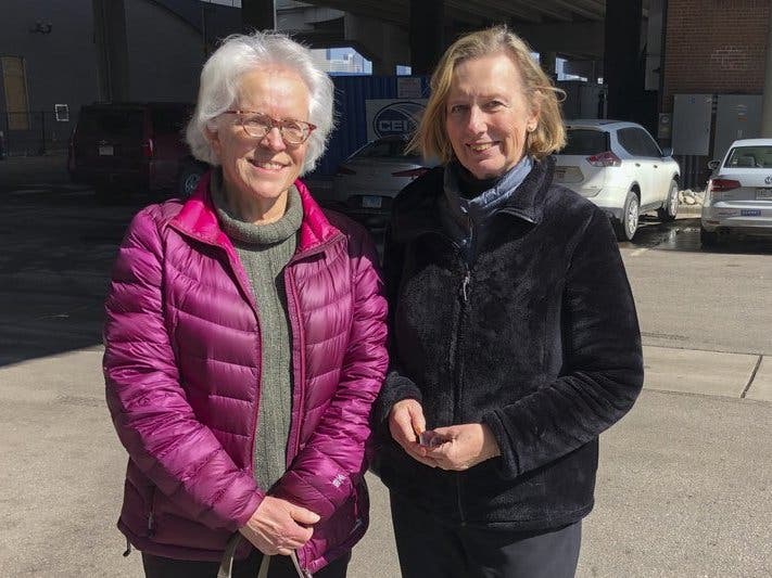 Linda Rosales, left, and Linda Dee pose for a photo after they carpooled to a campaign event with Sen. Amy Klobuchar, D-Minn., in Denver.