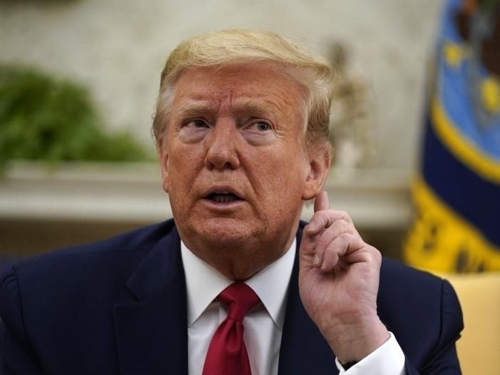 President Donald Trump listens during a meeting about the coronavirus with Gov. John Bel Edwards of Louisiana.