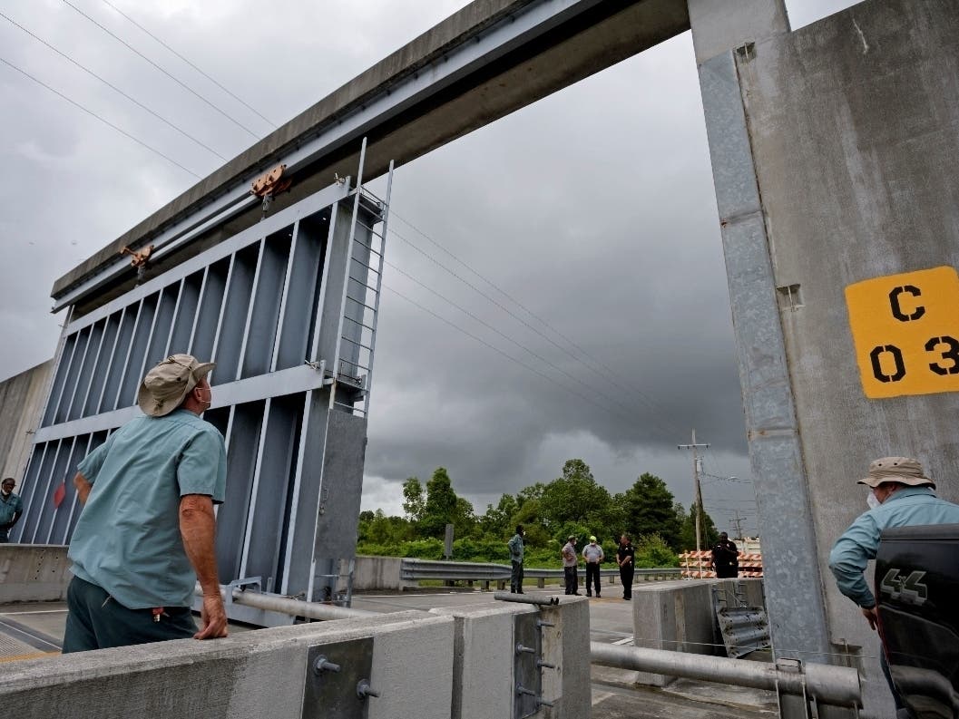 Crews from the Southeast Louisiana Flood Protection Authority East close the Bayou Road flood gate in St. Bernard Parish, Louisiana. 