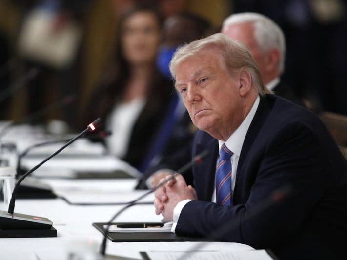 President Donald Trump listens during a "National Dialogue on Safely Reopening America's Schools," event in the East Room of the White House. 