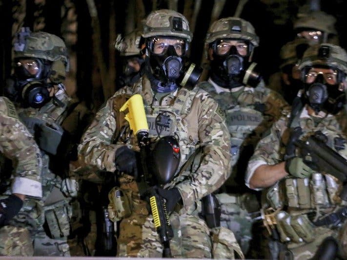 Federal officers deployed tear gas and fired less-lethal rounds into a crowd of protesters late Thursday. The actions came just hours after the head of the Department of Homeland Security called the protesters “violent anarchists.” 