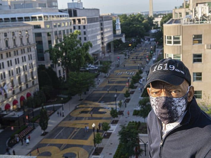 John Lewis looks over a section of 16th Street that's been renamed Black Lives Matter Plaza in Washington.