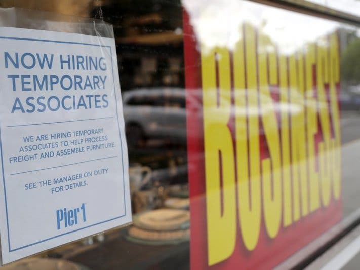 A sign advertises hiring of temporary associates at a Pier 1 retail store, which is going out of business during the coronavirus pandemic.