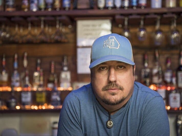 Todd Scott poses behind a bar in Porterdale, Ga.. on June 1, 2016.