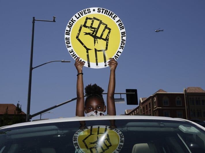 Ahead of Labor Day, major U.S. labor unions say they are considering work stoppages in support of the Black Lives Matter movement.