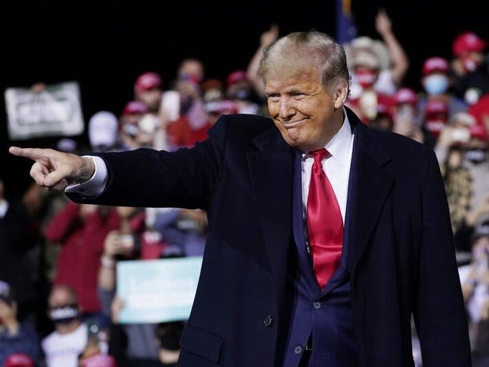 President Donald Trump wraps up his speech at a campaign rally at Fayetteville Regional Airport On Saturday.