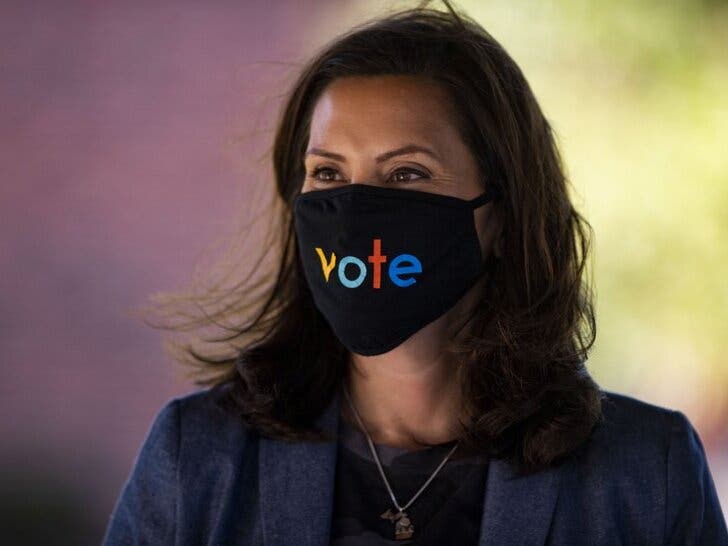 Michigan Gov. Gretchen Whitmer wears a mask with the word "vote" displayed on the front during a roundtable discussion on healthcare, Wednesday Oct. 7, 2020, in Kalamazoo, Michigan.