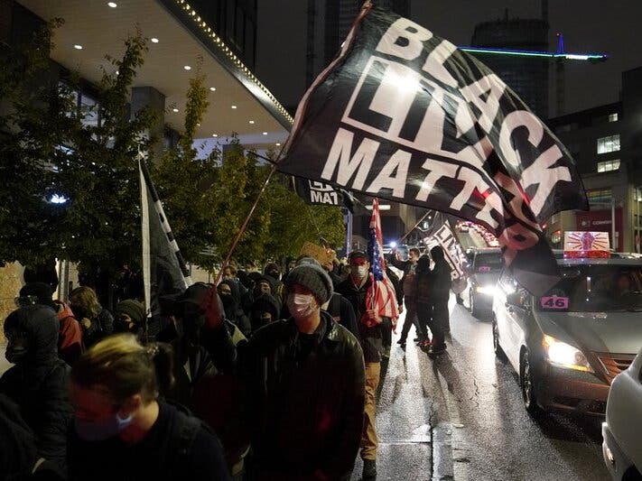 People march on the night of the election in Seattle on election night. 