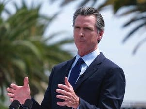California Governor Gavin Newsom talks during a news conference at Universal Studios in Universal City on Tuesday, June 15, 2021. Newsom is at risk of being on the recall ballot without his party ID – Democrat – next to his name. 