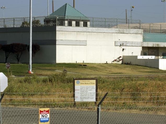 The Federal Correctional Institution is shown in Dublin, Calif., July 20, 2006. A fourth worker at a federal women’s prison in California has been charged with sexually abusing an inmate.