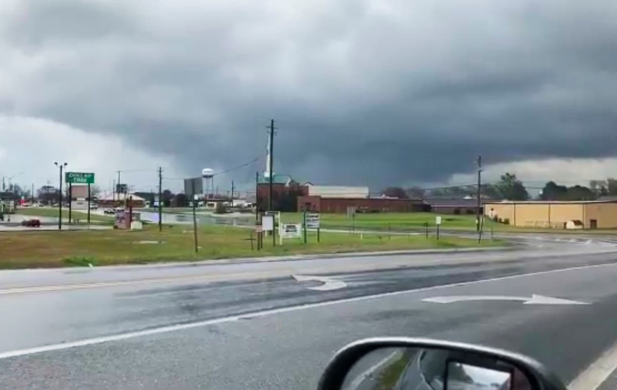 This photo provided by Greg Martin shows a funnel cloud in Byron, Georgia.