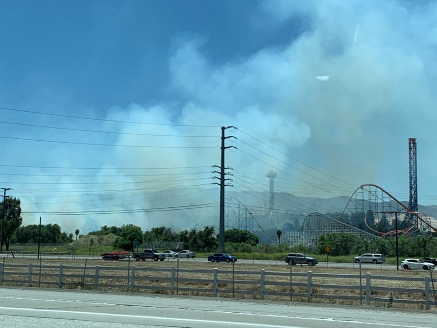 Photo shows smoke hovering over Six Flags Magic Mountain