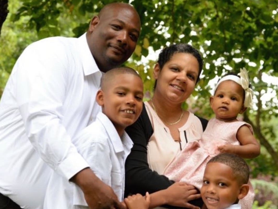Sandra Perez-Harrod poses with her husband and three kids.