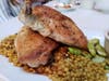 Roast chicken served with Israeli cuscus and Fava beans.