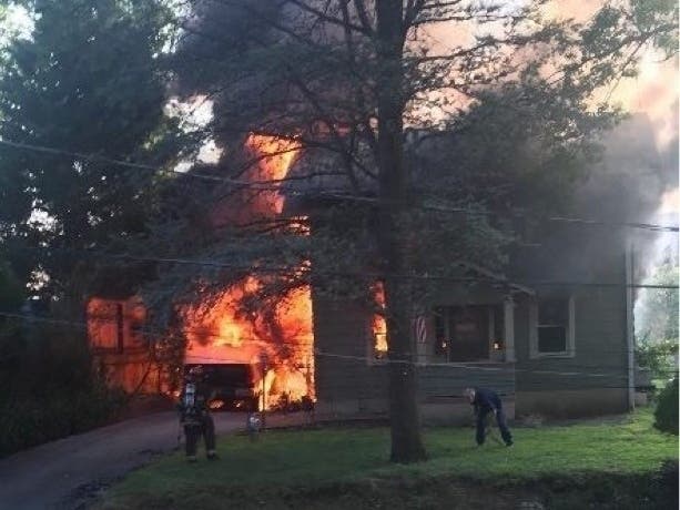 When a fire swept through his neighbor's home, Scott Trimarchi's quick thinking helped save his neighbor.