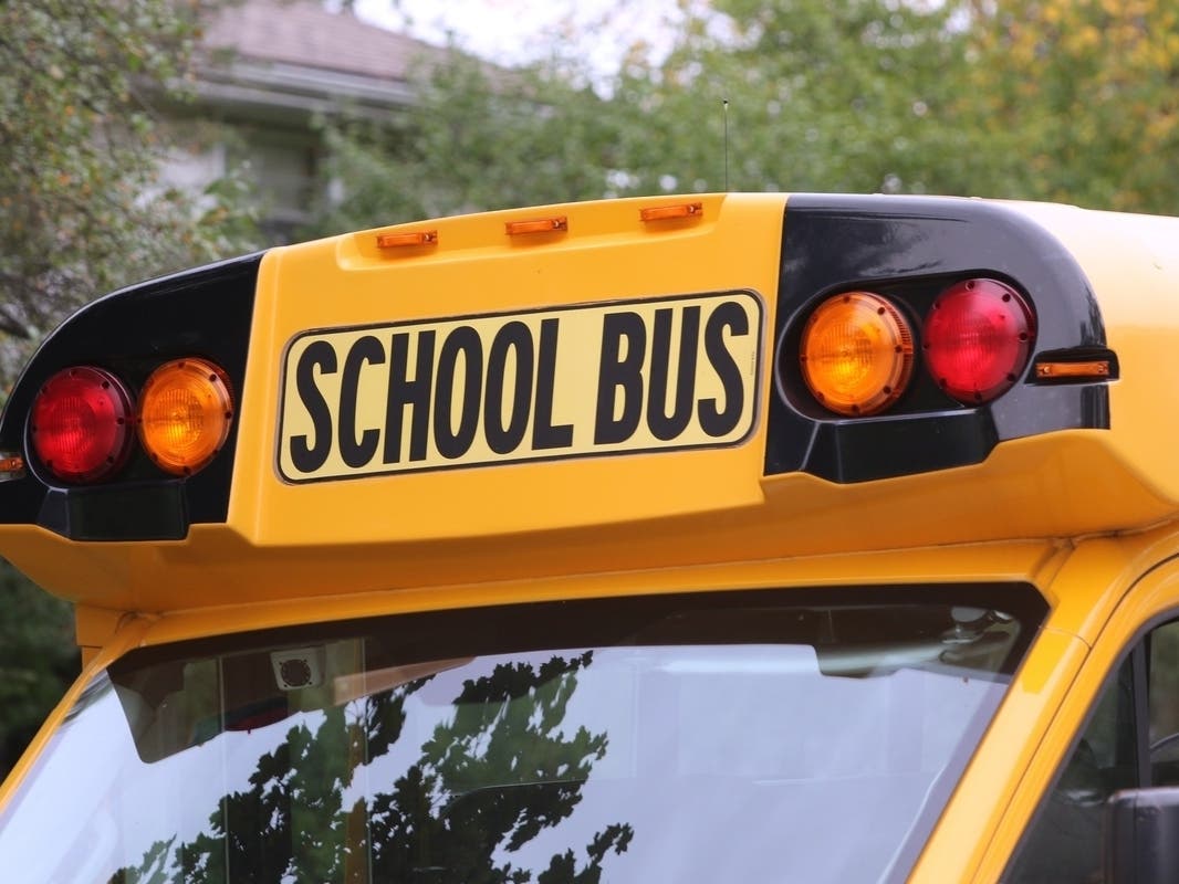 A school bus carrying children to a local yeshiva crashed into a utility pole, a house, and parked cars Thursday morning, according to a report.