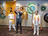 Kenneth Jacobsen, practice professor of law at Temple University, center, prepares to ring the Bell of World Peace and Love as Dr. Hong, Tao-Tze, the leader of Tai Ji Men, right, looks on in Washington. 