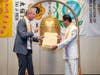 Kenneth Jacobsen, practice professor of law at Temple University, left, presents replicas of the U.S. Declaration of Independence and U.S. Constitution to Dr. Hong, highlighting the importance of the promotion of justice and the rule of law. 