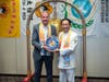 Kenneth Jacobsen, practice professor of law at Temple University, left, is presented with the Compass Clock of Conscience by Dr. Hong, Tao-Tze, the leader of Tai Ji Men, in Washington. 