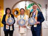 Nadine Maenza, former chair of USCIRF, left, and David Curry, president and CEO of Open Doors USA, right, are presented with the Compass Clock of Conscience by Dr. Hong, Tao-Tze, leader of Tai Ji Men.