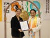 On behalf of Congresswoman Young Kim, her District Representative Abigail Fachtmann, left, presented to Dr. Hong, Tao-Tze, president of FOWPAL and leader of Tai Ji Men, a Certificate of Congressional Recognition.