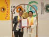 California State Senator Josh Newman, left, rang the Bell of World Peace and Love and presented to Dr. Hong, Tao-Tze, president of FOWPAL and leader of Tai Ji Men, a California Senate Certificate of Recognition.