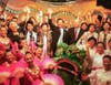 Dr. Hong, Tao-Tze, the leader of Tai Ji Men, center, was interviewed by MNN and hosted a ceremony of ringing the Bell of World Peace and Love and a cultural feast in September 2001.