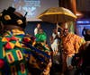 King of Sanzule Kingdom, Ghana, Okatakyie Asafo Boakye III, right, returns to his seat at the CBC 2022 African and Caribbean International Leadership Conference and Presidential Awards Gala in Washington. 