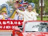 Dr. Hong, Tao-Tze, the leader of Tai Ji Men, waves his hand at spectators during the Parade of Faiths. He led nearly 120 Tai Ji Men members to promote the spirit of martial arts–stopping conflicts and promoting goodness.