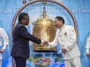 Dr. Hong, Tao-Tze, president of FOWPAL, right, shakes hands with Fritz Jean, former Prime Minister of Haiti and a member of its Transitional Presidential Council, before Jean rings the Bell of World Peace and Love.