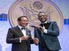 Dr. Hong, Tao-Tze, president of FOWPAL, left, receives Global Peace Award from Dr. Agorom Dike, founder and president of African and Caribbean International Leadership Conference for promoting peace, love, conscience, and the power of hope.