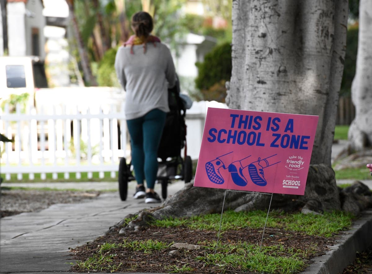 This is one of many signs part of the “Take the Friendly Road​" initiative.