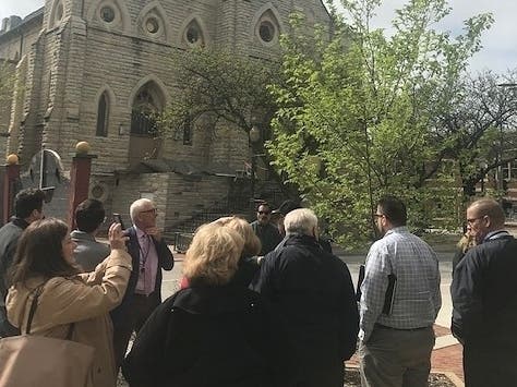 Steve Jones of City Hall leads a group of real estate investors on a walking tour of downtown Joliet. 