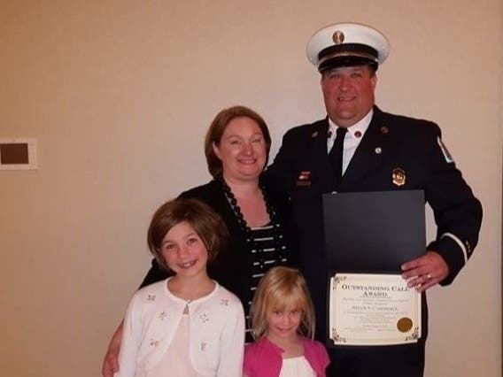 Firefighter/paramedic Shawn Carroll was hired at the Joliet Fire Department on  June 5, 2000.