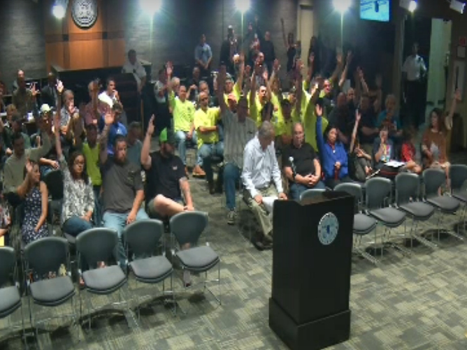 Councilwoman Jan Quillman asked for a show of hands of people supporting Marty Shanahan as city manager. 
