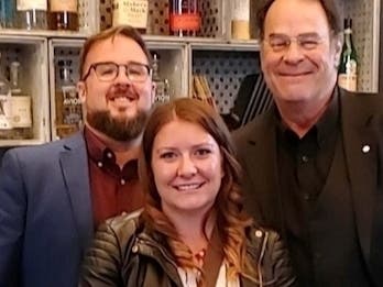 Joliet museum director Greg Peerbolte, special events coordinator Liz McNeil and "Blues Brothers" legend Dan Aykroyd.