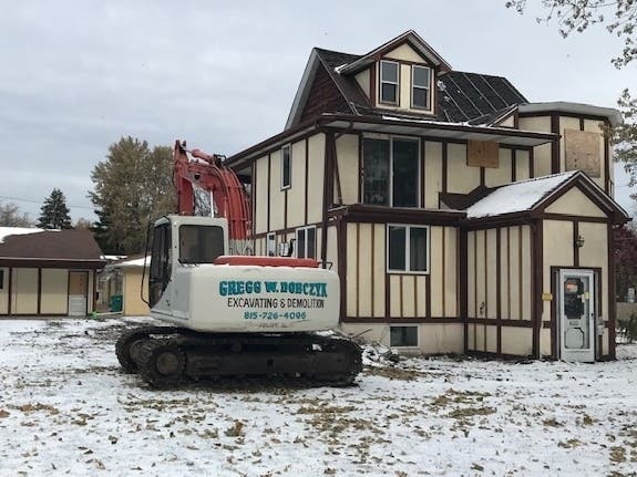 A demolition crane is parked in the yard at 1101 Black Road in Joliet. 