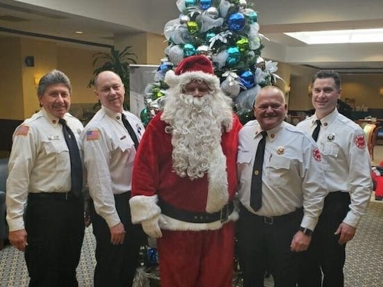 Capt Ron Fox, Lt. Eric Mattson, Santa, Fire Chief Greg Blaskey and Capt. Matt Ehrsam.