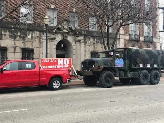 A couple Anti-NorthPoint protesters parked their vehicles near Joliet's Renaissance Center where Mayor Bob O'Dekirk gave his annual State of the City speech Monday. 
