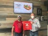 Jerrie's Dogs & More owner Jeff Reid (left) and Joliet State Farm insurance agent John Wright.