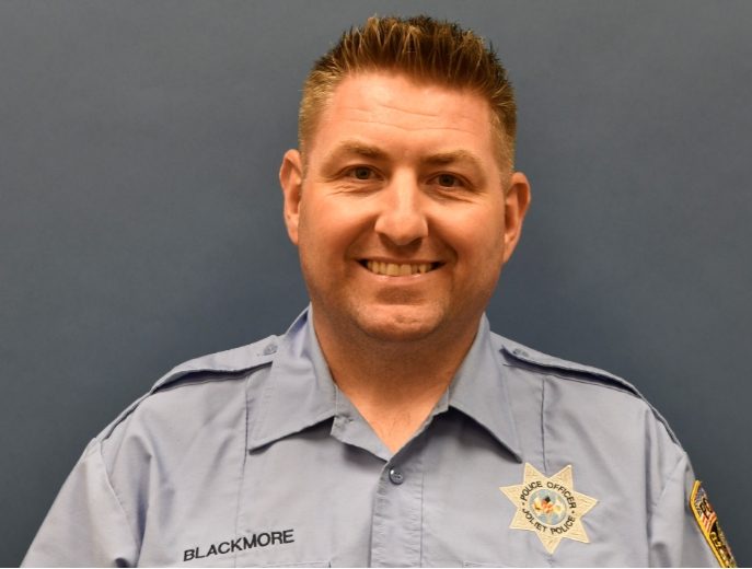 Joliet police Officer David Blackmore was recommended for termination by Joliet's police chief in December. He still gets his regular paycheck as of May.