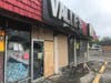 Authorities say that looters and rioters are suspected of setting Sunday night's fire at the Valle's Produce store on West Jefferson Street in Joliet.