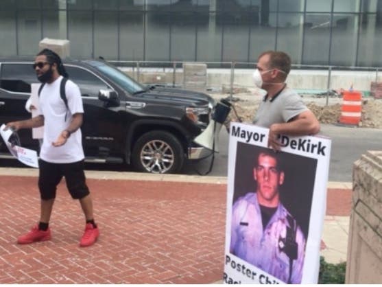 A small but vocal group of demonstrators converged on City Hall Tuesday afternoon calling for Mayor Bob O'Dekirk to resign. He won't, he insisted. 