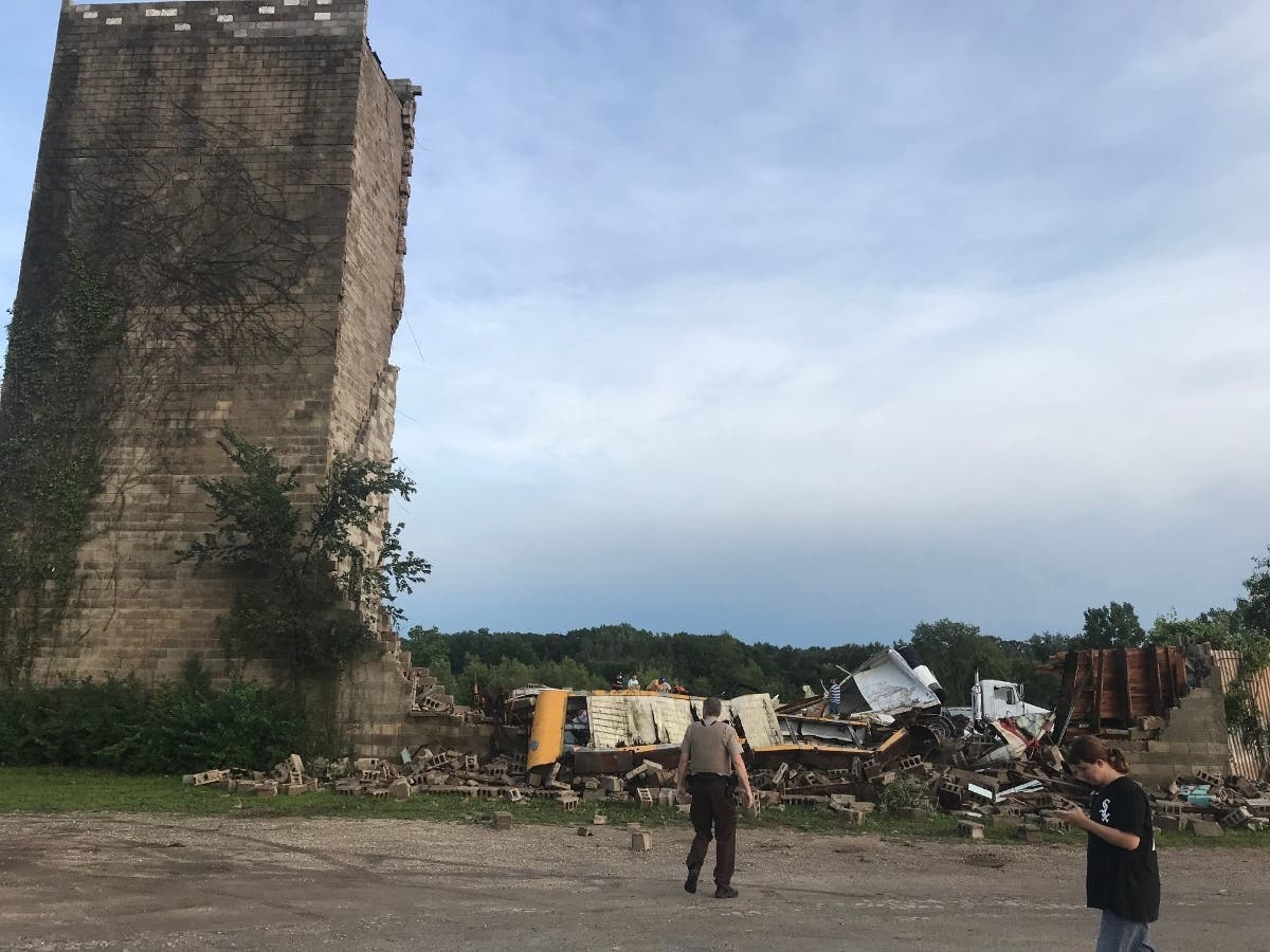 Between 50 and 100 onlookers stopped by the Hill-Top Drive-In Monday night to survey the damage. 