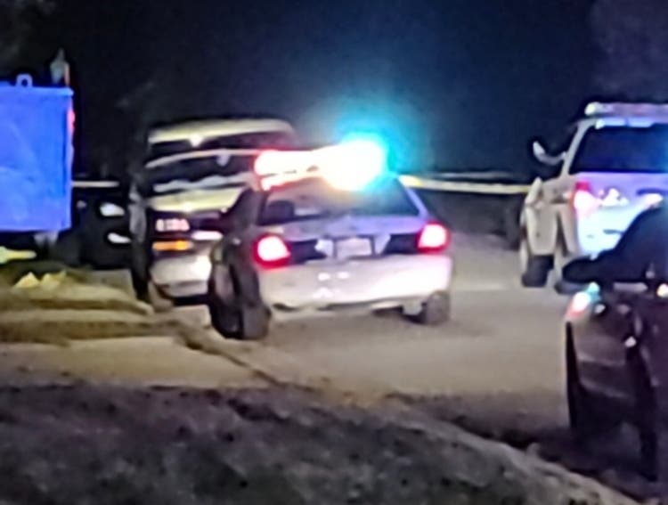 Joliet police officers investigate a Wednesday night shooting on Miller Avenue. 