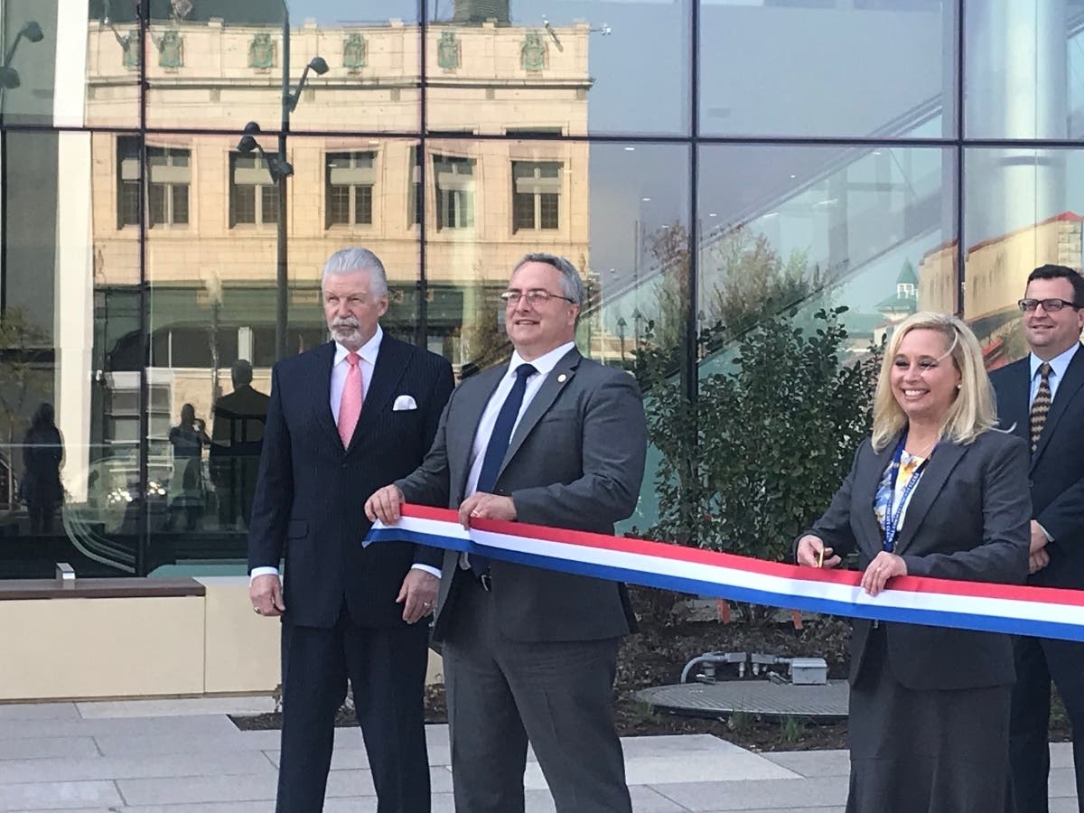 Dozens of Will County elected officials took turns posing in front of the new $215 million Will County Courthouse.