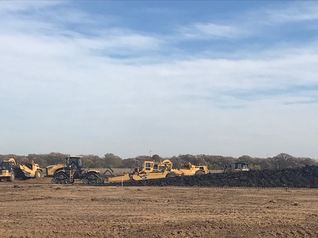 Several earthmovers were at it Wednesday for Joliet's mega development near I-80 and I-55 called Rock Run Crossings. 
