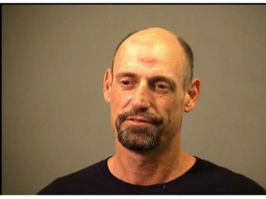Scott Hasenjaeger was hauled away in handcuffs by Joliet police on Friday night. It's his second domestic violence arrest by Joliet police since December.
