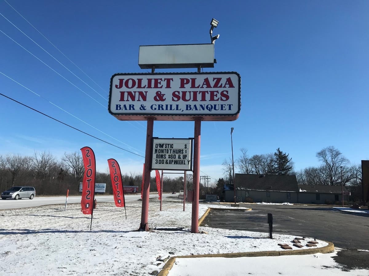 Joliet police arrested a 49-year-old man who lives at the Joliet Plaza Inn & Suites early Friday morning. 